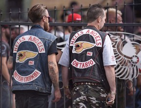 Members of the Hells Angels from British Columbia and Ontario enter the Hells Angels Nomads compound during the group's Canada Run event in Carlsbad Springs, Ont., near Ottawa, on Saturday, July 23, 2016.  CANADIAN PRESS FILE PHOTO