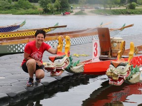 Linda Kuska, Rowbust captain and festival co-chair, shows off two dragon boats used during the Fanshawe Dragon Boat Festival. The festival raises money for the ACT Now fund, which helps cancer patients pay for medications not covered by health insurance. (Shannon Coulter / The London Free Press)