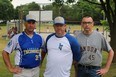 Tecumseh club president Wayne Bilger (left), board member and coach Andrew Angus and Ward 2 councillor candidate Shawn Lewis at CNRA Park for Opening Day on Sunday. The team ran a fundraiser during opening day to raise money for equipment they lost during their storage shed break-ins. (Shannon Coulter / The London Free Press)