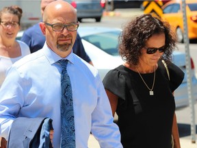 Scott and Sandra Shannon, the parents of Riley Shannon, who was killed while trying to stop three friends from taking a skid steer on a joy ride on May 11, 2017, leave the London courthouse during a break on Friday. DALE CARRUTHERS / THE LONDON FREE PRESS