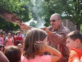 Daniel Pelletier, a Metis educator of Ojibway and French heritage, teaches pupils at Academie de la Tamise about smudging. (SHALU MEHTA, The London Free Press)