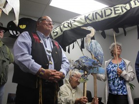 Chief Myeengun Henry from the Chippewas of the Thames makes a speech on behalf of protesters in MP Kate Young's office on Monday, June 4. A group of Londoners urged the federal government to end the $4.5 billion deal with Kinder Morgan. (MEGAN STACEY, The London Free Press)