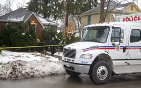 A London police officer leaves 56 Duchess Ave. in the days after the fatal 2016 London police shooting of Samuel Maloney. (Picture file)