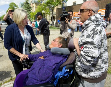 NDP leader Andrea Horwath talks with Elane Williams and her husband Gerry, who wanted to talk about the Ontario Disability Support Program (ODSP) during a St. Thomas campaign stop on Monday. Mike Hensen/The London Free Press/Postmedia Network