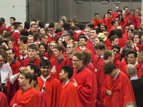 A student snaps a selfie amidst a sea of fellow grads prior to the start the first Fanshawe College graduation day of 2018 at the Agriplex in London, Ont. on Tuesday June 5, 2018. Tuesday's ceremony was the largest ever for the college with more than 800 graduates in attendance. Tuesday's grads were from the Faculty of Arts, Media and Design as well as the Faculty of Technology. Four more graduation ceremonies will be held over the next two days. Derek Ruttan/The London Free Press/Postmedia Network