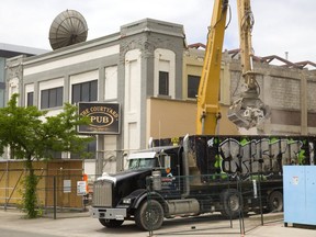 Demolition continues on two city owned buildings next to the London Convention Centre on York Stree and Wellington Street in London. (Mike Hensen/The London Free Press)