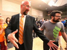 Terence Kernaghan celebrates as he walks into a provincial NDP election party after winning in London North Center on June 7, 2018. Mike Hensen/The London Free Press