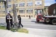 A cyclist was killed after colliding with flat bed transport truck on Adelaide Street just north of Dundas Road in London. (Derek Ruttan/The London Free Press)