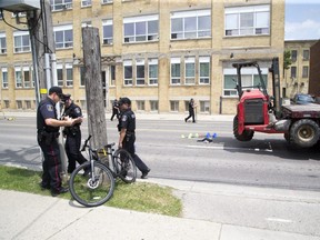 A cyclist was killed after colliding with flat bed transport truck on Adelaide Street just north of Dundas Road in London. (Derek Ruttan/The London Free Press)