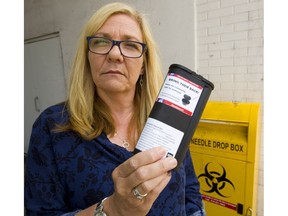 Sonja Burke, director of Counterpoint Harm Reduction Services at Regional HIV/AIDS Connection in London, shows a personal-sized sharps container that's popular with needle users because it's safe and easily stowed in a pocket or a sock.