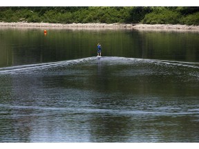 A paddle boarder  skims along the top of Fanshawe Lake in London, Ont. on Friday June 15, 2018. Derek Ruttan/The London Free Press