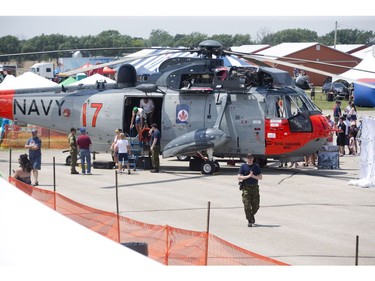 People line up to tour the Canadian Armed Forces  Sea King helicopter on display during the 2018 Great Lakes International Airshow in St. Thomas. This is the last year for people to see the Sea King. The Canadian Forces' aged fleet of Sea Kings is being replaced by CH-148 Cyclones. Derek Ruttan/The London Free Press