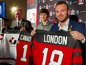 Todd Sargeant, left, the chair of the local host organizing committee, along with Team Canada sledge hockey teammates James Dunn, of Wallacetown, and Tyler McGregor, of Forest,  announce the Canadian Tire Para Hockey Cup to be held at the Western Fair Sports Centre Dec. 1-8 during a news conference Monday.  Mike Hensen/The London Free Press