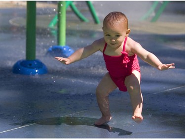 A slight issue with balance didn't slow down Elle Scheltema, 13 months old, who took to the water like a duck as she repeatedly went into the splash pad in Gibbons Park with her mom, Tara Collings, on Friday. (Mike Hensen/The London Free Press)