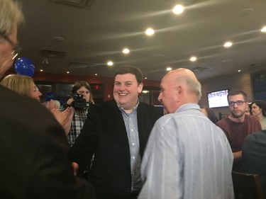 Progressive Conservative London West candidate Andrew Lawton talks with supporters Thursday after taking a loss to New Democrat Peggy Sattler. (SHALU MEHTA, The London Free Press)