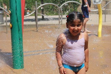 Jasylym Mandair, 5, cools off at the spray pad near Ivey Park on Friday. (Shalu Mehta/London Free Press)