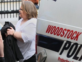Elizabeth Wettlaufer is escorted into the courthouse in Woodstock, Ont., on Friday, April 21, 2017. Wettlaufer is accused of killing eight seniors in two long-term care homes. THE CANADIAN PRESS/Dave Chidley ORG XMIT: DJC104