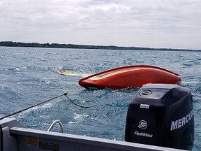 Huron OPP and the Canadian Coast Guard rescued three Londoners after a sailboat capsized on Lake Huron about two kilometres north of Bayfield Sunday morning. (Huron OPP)