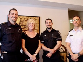 John Clarke (left), Ruthe Andrew, Jason DeHoey, and Dustin Carter work together to keep Ruthe's husband, Arch, safe. They are part of a pilot remote patient monitoring program, where paramedics can monitor Arch's vital signs while he's at home. (SHALU MEHTA/THE LONDON FREE PRESS)