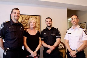 John Clarke (left), Ruthe Andrew, Jason DeHoey, and Dustin Carter work together to keep Ruthe's husband, Arch, safe. They are part of a pilot remote patient monitoring program, where paramedics can monitor Arch's vital signs while he's at home. (SHALU MEHTA/THE LONDON FREE PRESS)