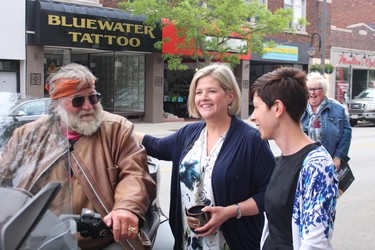 NDP leader Andrea Horwath greets local resident Lloyd MacLean who pulled her motorcycle to the curb to meet her and Sarnia-Lambton candidate Kathy Alexander. NEIL BOWEN/Sarnia Observer