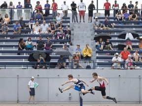 Adam Exley from Resurrection Catholic Secondary School and Matthew MacNeill, left, from A.B. Lucas Secondary School in London, compete in the senior men's 110-meter hurdles at the OFSAA West Regionals Track and Field Meet at Alumni Field, Friday, June 1, 2018.  (DAX MELMER/Windsor Star)