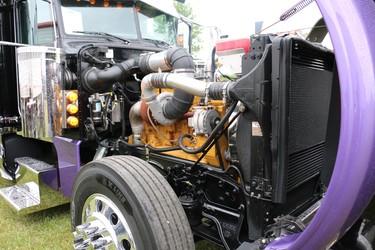 At Trucking for Kids, a truck with the hood lifted up allows visitors to take a look at the engine. (SHANNON COULTER, The London Free Press)