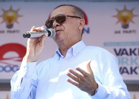 Turkey's President and ruling Justice and Development Party Leader Recep Tayyip Erdogan addresses his supporters during an election rally in Sanliurfa, Turkey, Wednesday. 'Turkey holds parliamentary and presidential elections on Sunday. (Presidential Press Service via AP, Pool)