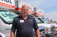 David Heimpel, the field relief manager at U-Haul, stands in front of a full lot of trucks on Monday. He says that by the weekend, most of them will be gone as people move on the long weekend.