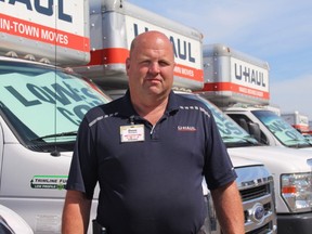 David Heimpel, the field relief manager at U-Haul, stands in front of a full lot of trucks on Monday. He says that by the weekend, most of them will be gone as people move on the long weekend.