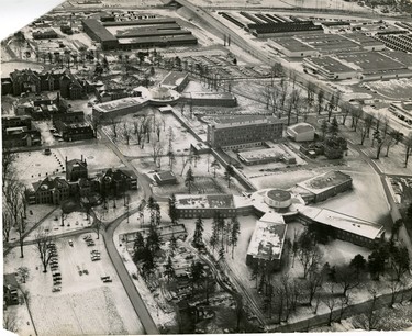 Aerial of Ontario Hospital, shown here in southwesterly view, on each side of the central medical wing are two wheel-type pavilions, connected by corridors to the main wing. The reconstruction aligns the hospital to Highbury Avenue instead of Dundas Street. At left are remaining old buildings of the hospital. At top is No. 27 Central Ordnance Depot with the Highbury Avenue overpass crossing the CPR, 1967. (London Free Press files)