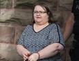 Elizabeth Wettlaufer is escorted by police from the courthouse in Woodstock. (File photo)