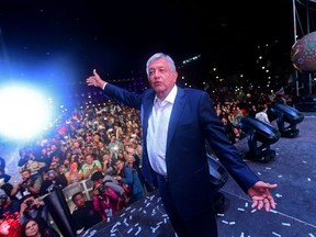 Newly elected Mexico's President Andres Manuel Lopez Obrador, running for "Juntos haremos historia" party, cheers his supporters at the Zocalo Square after winning general elections, in Mexico City, on July 1, 2018. / AFP PHOTO / PEDRO PARDOPEDRO PARDO/AFP/Getty Images