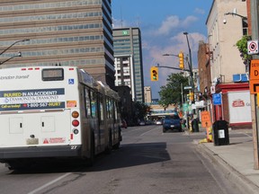 An LTC bus drives near the bicycle lane at King and Talbot Streets. (SHALU MEHTA/THE LONDON FREE PRESS)