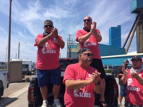 Gary Lynch, president of Unifor Local 16-0, Glenn Sonier, Unifor national rep and Scott Doherty, assistant to Unifor president Jerry Dias, announce the Goderich salt mine contract has been ratified. (JANE SIMS, The London Free Press)