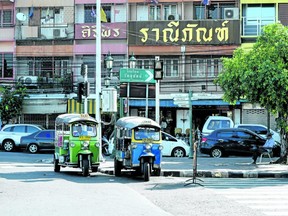 Tuk tuks wait for passengers on a busy street in downtown Chiang Mai.
(Jennifer Bieman/The London Free Press)