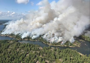 An aerial view taken over the Parry Sound 33 fire is shown in this handout image. The blaze, known as Parry Sound 33, sprung up on July 18. Ontario firefighters have been fighting it with the help of their counterparts from other provinces, as well as the United States and Mexico. THE CANADIAN PRESS/HO-AFFES Ignition/Response Specialist-Dan Leonard