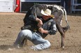 Matt Reeves, Cross Plains, Texas,  twists his steer to win the Steer Wrestling final in the Stampede Rodeo at the Calgary Stampede in Calgary, Ab., on Sunday July 15, 2018. Mike Drew/Postmedia