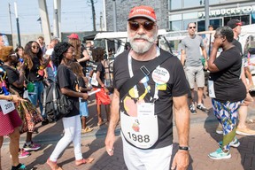 A participants takes part in the Positive Flame for Aids procession, from the AIDS Monument through Amsterdam, on the third day of the AIDS2018 Conference in Amsterdam.  (WENN.com)