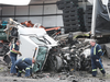 The wreckage of a collision between two tractor-trailers is shown on Friday, June 22, 2018 on Highway 401 near Tilbury. One driver was killed and the other hurt. (Postmedia)