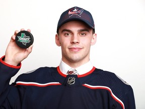 Liam Foudy poses after being selected eighteenth overall by the Columbus Blue Jackets during the first round of the 2018 NHL Draft at American Airlines Center on June 22, 2018 in Dallas, Texas.  (Photo by Tom Pennington/Getty Images)