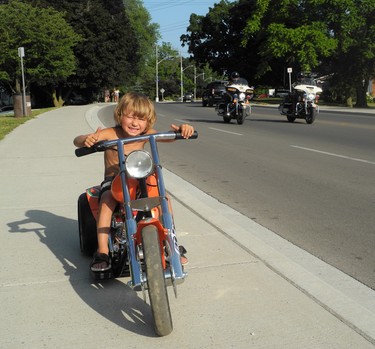 Brody Gamble of Brantford is only four years old yet already he’s got an appetite for the open road. Brody took his hog for a cruise along Main Street Thursday on the eve of the massive Friday the 13th motorcycle rally in Port Dover. (MONTE SONNENBERG \ SIMCOE REFORMER)