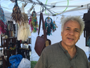 Ali Bssi, a Toronto-based vendor who sells leather goods from North Africa and Indonesia, has set up shop at Sunfest in Victoria Park. (Jennifer Bieman/The London Free Press) 