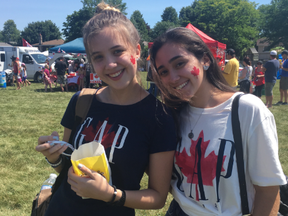 Maria Estrella (left) and Heloisa Lima celebrated Canada at White Oaks Park in London. They love that Canadians are so friendly.