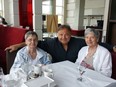 Cécile Dionne, left, and sister Annette with Carlo Tarini in June: “There was a lot of suffering for the sisters as part of their childhood,” Tarini says. “What we want to do is talk about the good that can come out of their existence and their survival."