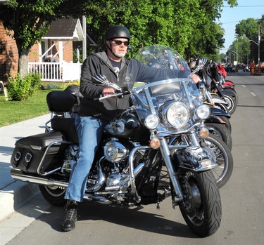 Main Street parking spaces were hard to come by around 9 a.m. during the massive Friday the 13th motorcycle rally in Port Dover. Easing his ride to the curb here is Garry Crowe of Rockwood. (MONTE SONNENBERG \ SIMCOE REFORMER)