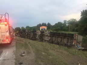 A tractor trailer overturned on Highway 402 Friday, causing police to block traffic in both directions. (Photo courtesy Sarnia Fire Rescue Services)