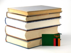 Zambia flag with pile of books (Getty Images)
