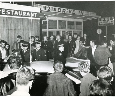Provincial police rules with an iron hand ats the holiday season opened at Grand Bend, there were minor disturbances when arrests were made fo rinfractions of liquor laws, 1967. (London Free Press files)