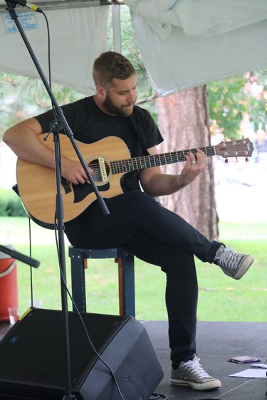 Jake Charron, of Dan Stacey and the Black Swans, performs at the north concert stage Saturday during the Home County Music and Art Festival. (SHANNON COULTER, The London Free Press)